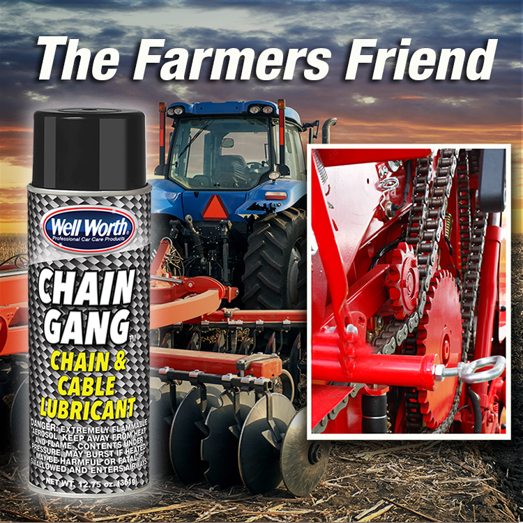 Well Worth Products Chain Gang chain & cable lubricant "The Farmers Friend" in front of a tractor