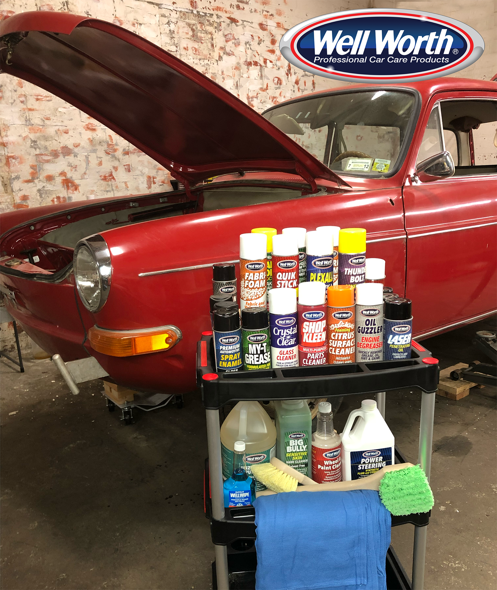 photo of a rolling work cart filled with cleaning, detailing and maintenance products in front of a 1973 VW squareback with its hood open and the logo: Well Worth Professional Car Care Products