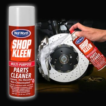 Two cans of Well Worth Professional Car Care Products Shop Kleen Multi-Purpose Parts Cleaner: one can is upright in the front of the photo, the other is being sprayed on a metal wheel.